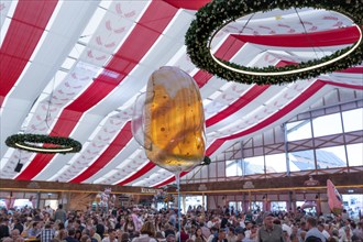 Balloon as a beer glass in a well-attended beer tent during the Kulmbach Beer Week, Kulmbach, Upper