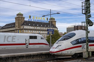 Essen main station, ICE trains on the tracks, in the background the Handelshof, city centre of