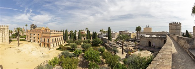 Panoramic view of a cityscape with historic buildings, gardens and palm trees, Jerez