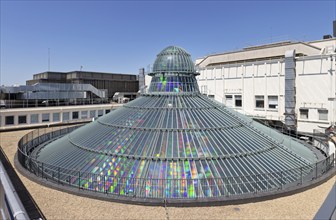 Futuristic glass roof with rainbow-coloured reflections, Paris