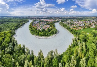 Loop of a river in the middle of lush nature with a small village and cloudy sky, Mühldorf am Inn