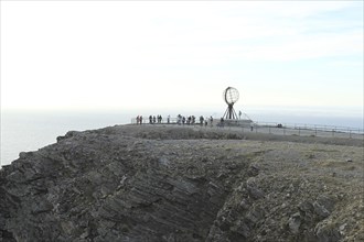 North Cape with steel globe and visitors, Lapland, Northern Norway, Norway, Scandinavia, Europe