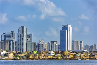 Skyscrapers in the city of Recife in Pernambuco behind the favela on the banks of the Capibaribe