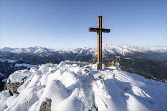 Snow-covered summit of the Jenner with summit cross in autumn, Berchtesgaden National Park,