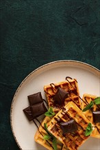 Viennese waffles, with chocolate, breakfast, on a dark background, no people, selective focus,