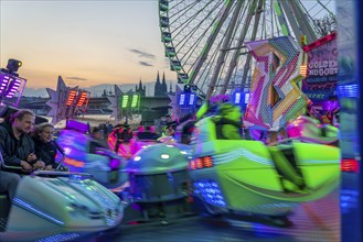 Deutz funfair on the Rhine, at Easter, funfair, break-dancer ride, Ferris wheel, Cologne Cathedral,