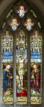 Stained glass window of Crucifixion church of Saint George, Ogbourne St George, Wiltshire, England,