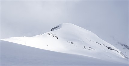 Snow-covered mountain landscape on the Wildhorn, cloudy mood, high tour, Bernese Alps, Bernese