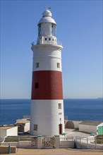 Red and white striped lighthouse at Europa Point, Gibraltar, British territory in southern Spain,