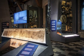 WWI soldier's equipment on display and battlefield map in the In Flanders Fields Museum about World