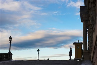 Silhouette of the royal palace in the evening sun, evening mood, guard, royal house, monarchy,