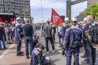 Steelworkers at a demonstration in front of the headquarters of ThyssenKrupp Steel Europe in