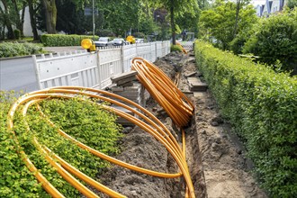 Laying of fibre optic cables, empty conduits are laid under a pavement, in which the actual fibre