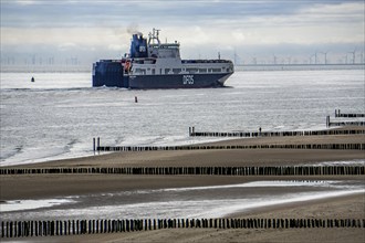 The DFDS cargo ferry Begonia Seaways, loaded with lorry trailer and new cars, leaves the