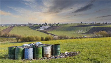 Symbolism, barrels of industrial waste deposited in the landscape, AI-generated, AI-generated, AI