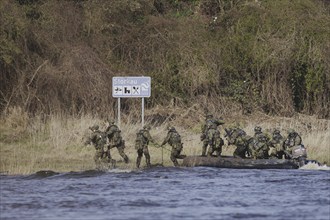 Soldiers on an inflatable boat, taken as part of the military exercise 'Wettiner Schwert' with