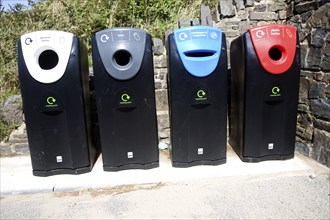 Four recycling bins for sorted refuse collection