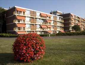 Apartment housing orange window blinds, Katwijk, Holland