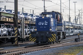 Car train, goods train on its way to the car terminal in Bremerhaven seaport, new German cars for