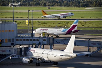 Düsseldorf Airport, Pegasus Airline, Airbus A321neo on approach, Eurowings Airbus on the taxiway