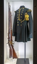 Carbines and Belgian uniform jacket of 3rd Regiment of Foot Chasseurs inside Fort van Liezele, WW1