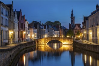 European medieval night city view background, Bruges (Brugge) canal in the evening, Belgium, Europe