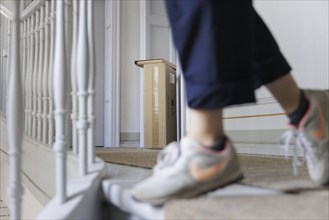 Parcels are left in front of a front door in a residential building in Berlin, 08/08/2024