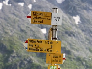 Signpost indicating highest point on Furka mountain pass, hiking pass directions, Switzerland,