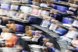 Zoom effect photo, Member of Parliament in the plenary hall of the German Bundestag, Berlin, 13