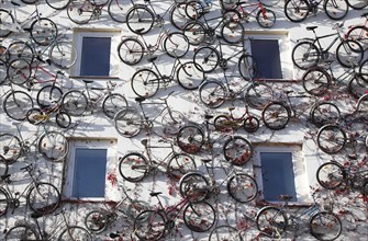 Bicycles are mounted on a house wall of a bicycle dealer, Altlandsberg, 19 October 2012,