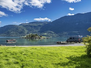 Campervan at the Sognefjord, island in the back, summer, Norway, Europe