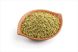 Clay bowl with raw green mung bean isolated on white background. Side view, close up