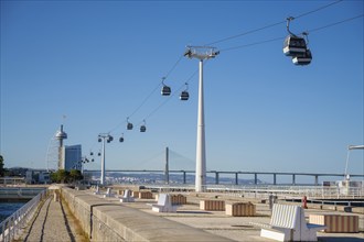 Telecabine Cable car in Lisbon in Parque des Nacoes Nations Park with Vasco da Gama bridge. Lisbon,