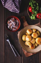 Fresh Cooked, new potatoes, with dill, on a wooden table, selective focus. close-up, toning, no