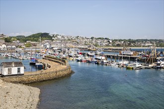 Boats at moorings in the harbour of fishing port of Newlyn, Cornwall, England, UK