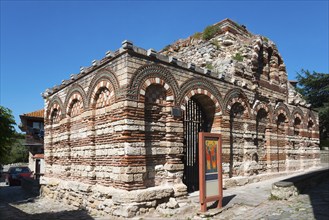 Historic church ruins made of red bricks under a clear blue sky, Church of the Holy Archangels