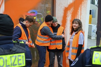 Last Generation activists in police custody after colour attack on Total Energies building. They