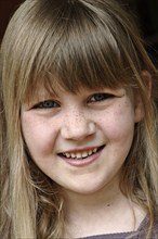 Laughing girl with freckles, 5 years, Close up, Bavaria, Germany, Europe