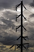 Electricity pylons and storm clouds