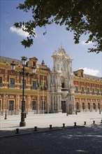 San Telmo palace building facade with columns at the entrance decorated with carved statues and