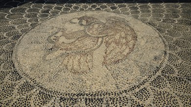 Pebble mosaic with an intricate facial motif, Mandraki, Nisyros, Dodecanese, Greek Islands, Greece,