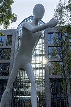 Walking Man, monumental sculpture by Jonathan Borofsky made of steel and plastic, pedestrian,