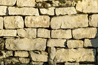 Dry masonry, wall made of natural stones in the evening light, background image, Wülzburg Fortress,