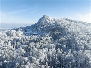 Aerial view of the snow-covered Hegau volcano Hohenstoffeln, with the former basalt quarry,