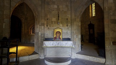 Icon of the Mother of God, church interior with altar, on it an icon, Gothic arches and windows,