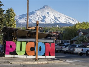 Street in center of Pucon, volcano Villarica in the back, La Auracania, Chile, South America