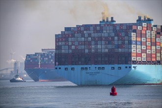 Harbour tugs bring the container freighter Madison Maersk from its berth at the RWG Container