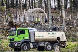 Spraying of a cleared forest area on which spruce trees infested by the bark beetle have died, thus