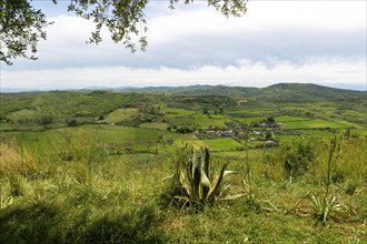 View south east from Apollonia over fields, countryside, hills, village of Kryegjatë, Fier County,