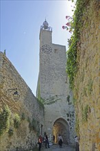 Tour de l'Horloge, clock tower and town gate with bell cage, town tower, tourists,